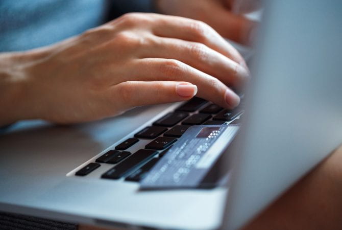hands-using-laptop-and-credit-card-on-it.jpg hands-using-laptop-and-credit-card-on-it.jpg